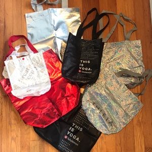 Assortment of 7 lululemon + Athleta totes